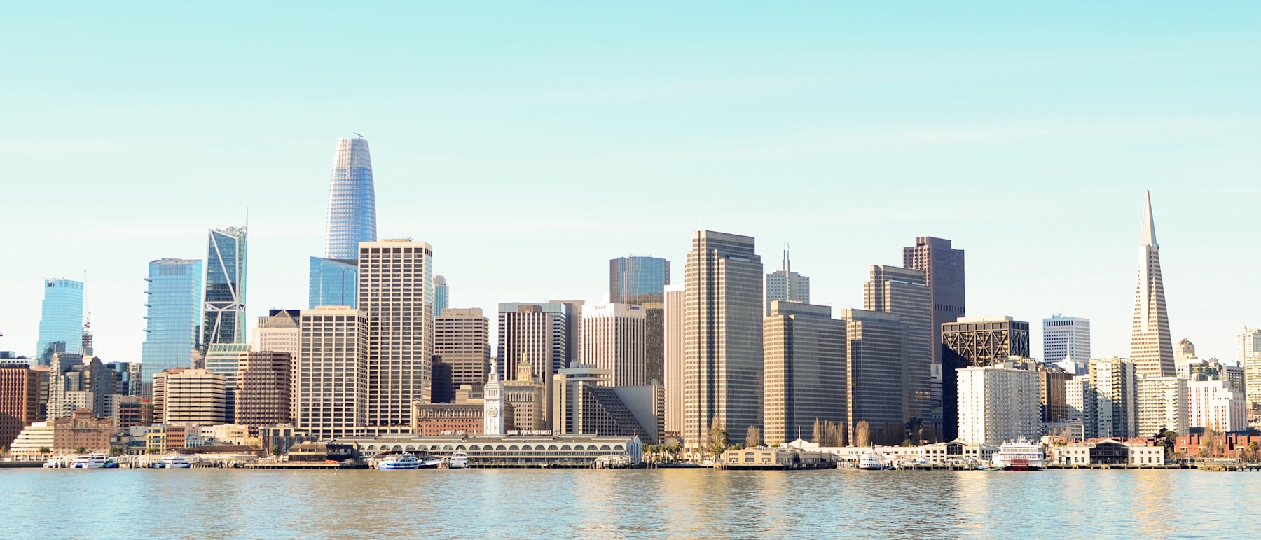City skyline across the water during daytime