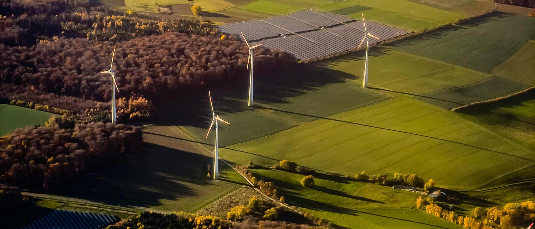 Wind turbines and solar panels in a rural landscape